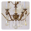an elegant french 1940's gilt metal 6-light chandelier with crystal pendants