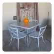 a stylish american 1960's five piece aluminum patio set with square glass-top table and 4 side chairs; by brown jordan