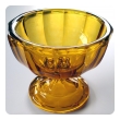 a heavy and thickly-modeled bohemian mid-century pedestal bowl of honey-colored glass; by moser glassworks