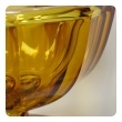 a heavy and thickly-modeled bohemian mid-century pedestal bowl of honey-colored glass; by moser glassworks