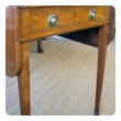 a fine english george iii satinwood single-drawer d-end pembroke table with kingwood inlay and ebony stringing; in the manner of thomas sheraton