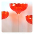 vibrant set of 3 murano 1960's orange glass compotes on clear glass stems