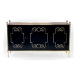 epoca american mid-century custom-made black lacquer 3-door sideboard/buffet with applied brass scrollwork and bronze mounts; by Daniel Jones, Inc., New York