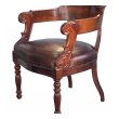 dramatically-carved and handsome french restoration mahogany barrel-back desk chair with bold acanthus leaves