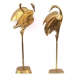 a graceful pair of stylized solid brass cranes