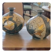 a large and striking pair of asian-inspired 1960's ceramic vases adorned with stylized birds