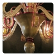 chic pair of murano gold-aventurine 6-light chandeliers with ruby-red trim