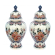 well-executed pair of delft polychromed hand-painted covered jars signed by the artist P. Verhoeve