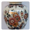 well-executed pair of delft polychromed hand-painted covered jars signed by the artist P. Verhoeve