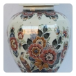 well-executed pair of delft polychromed hand-painted covered jars signed by the artist P. Verhoeve
