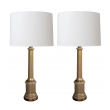 a good and stylish pair of hollywood regency mid-century columnar tan cased-glass lamps by paul hanson