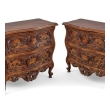 Pair of Louis XV provincial style walnut commodes, angled front view
