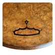 Close-up of satinwood and ebony inlay motif on burl walnut table surface