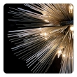 Illuminated Sputnik chandelier pair against black background showcasing warm lighting effects