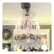 an elegant and graceful italian 1960's gilt-bronze and crystal 5-light chandelier