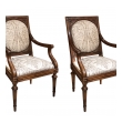 an exquisite and large-scaled pair of italian neoclassical carved walnut upholstered arm chairs