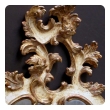 a fanciful venetian rococo revival ivory painted and parcel-gilt cartouche-shaped mirror