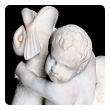 an expressive and well-carved italian rococo revival carrara marble niche fountain of a putti seated on a dolphin