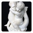 an expressive and well-carved italian rococo revival carrara marble niche fountain of a putti seated on a dolphin