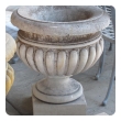 A Large-scaled French Neoclassical Carved Limestone Gadrooned Urns