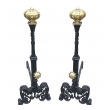 a large and stately pair of spanish tudor-style hand-wrought iron andirons with brass elements