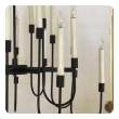 a stylish 1960's black enameled metal 12-arm candelabra style chandelier attributed to Tommi Parzinger 