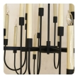 a stylish 1960's black enameled metal 12-arm candelabra style chandelier attributed to Tommi Parzinger 