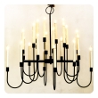 a stylish 1960's black enameled metal 12-arm candelabra style chandelier attributed to Tommi Parzinger 