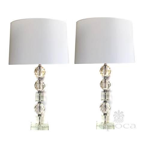 a shimmering and large-scaled pair of french mid-century stacked faceted crystal lamps