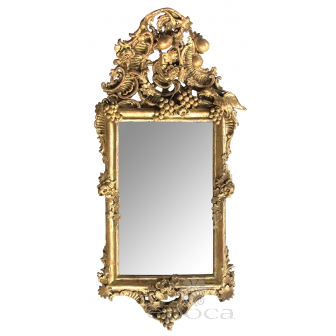 an ornately carved french rococo gilt-wood mirror with exuberant crest