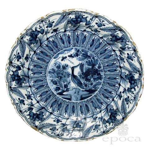 a boldly-scaled dutch delft blue and white charger with lobed rim