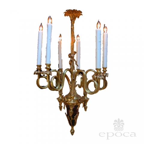a curvaceous french louis xv style gilt-bronze 6-light chandelier with dramatically scrolling candlearms