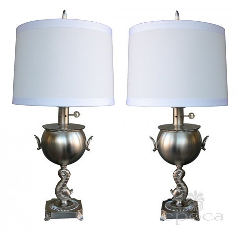 a stylish pair of american art deco brushed-nickel plated lamps with dolphin support