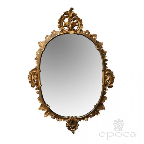 an elegantly carved  french louis XV rococo giltwood oval mirror