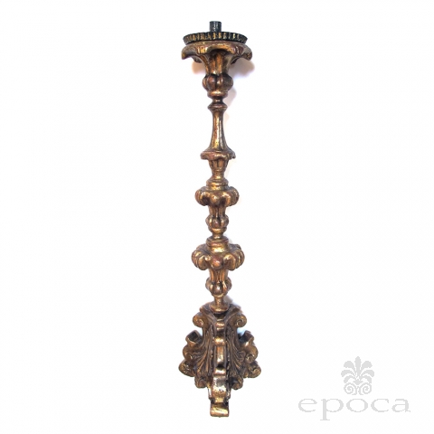 a boldly-scaled italian baroque carved giltwood candlestick