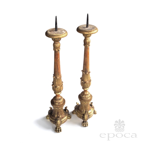 a good quality and large pair of italian baroque style giltwood tripod pricket sticks