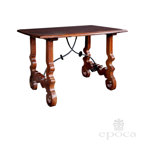 a rustic and well-patinated spanish baroque style walnut trestle Tables with iron stretcher