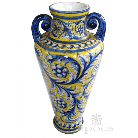 a thickly-modeled italian tin-glazed earthenware polychrome (majolica) double handled vase; possibly florence