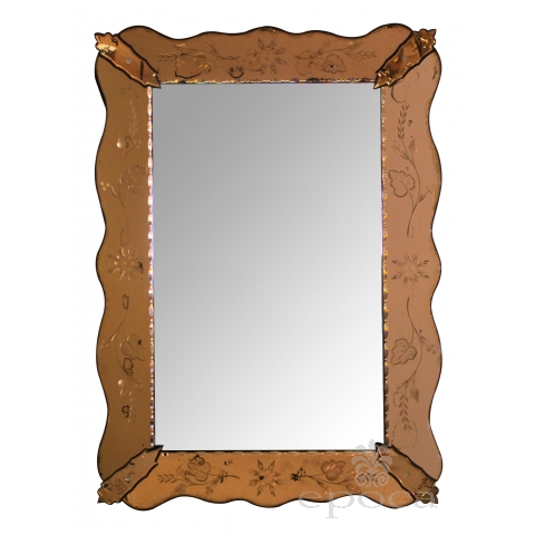 a shapely italian 1930's mirror with etched peach-colored surround