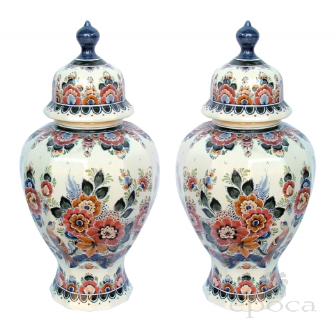 well-executed pair of delft polychromed hand-painted covered jars signed by the artist P. Verhoeve