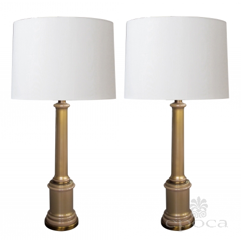 a good and stylish pair of hollywood regency mid-century columnar tan cased-glass lamps by paul hanson