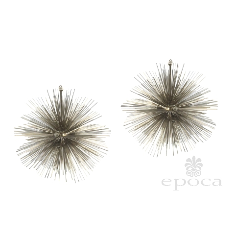 "Pair of Jean de Merry Sputnik chandeliers with nickel-plated spikes on white background"