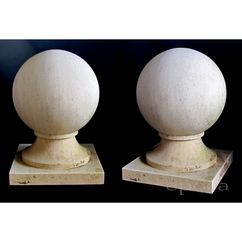 a massive and stately pair of french carved limestone orb-form garden elements