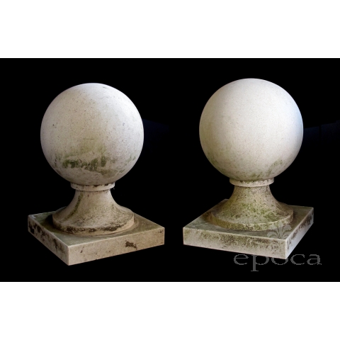 a stately pair of french neoclassical style carved limestone orb-form garden elements