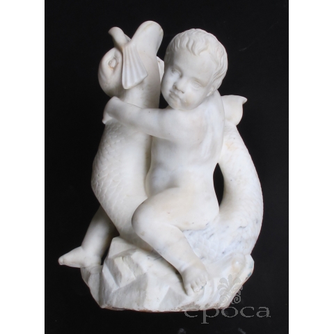 an expressive and well-carved italian rococo revival carrara marble niche fountain of a putti seated on a dolphin
