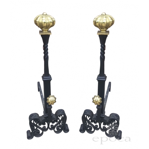 a large and stately pair of spanish tudor-style hand-wrought iron andirons with brass elements